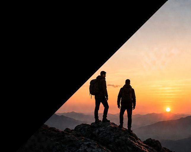 Silhouettes on a mountain ridge at sunset