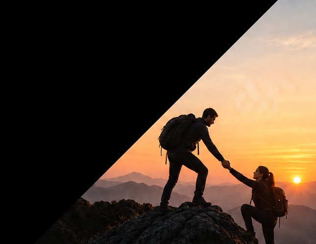 Silhouettes on a mountain ridge at sunset